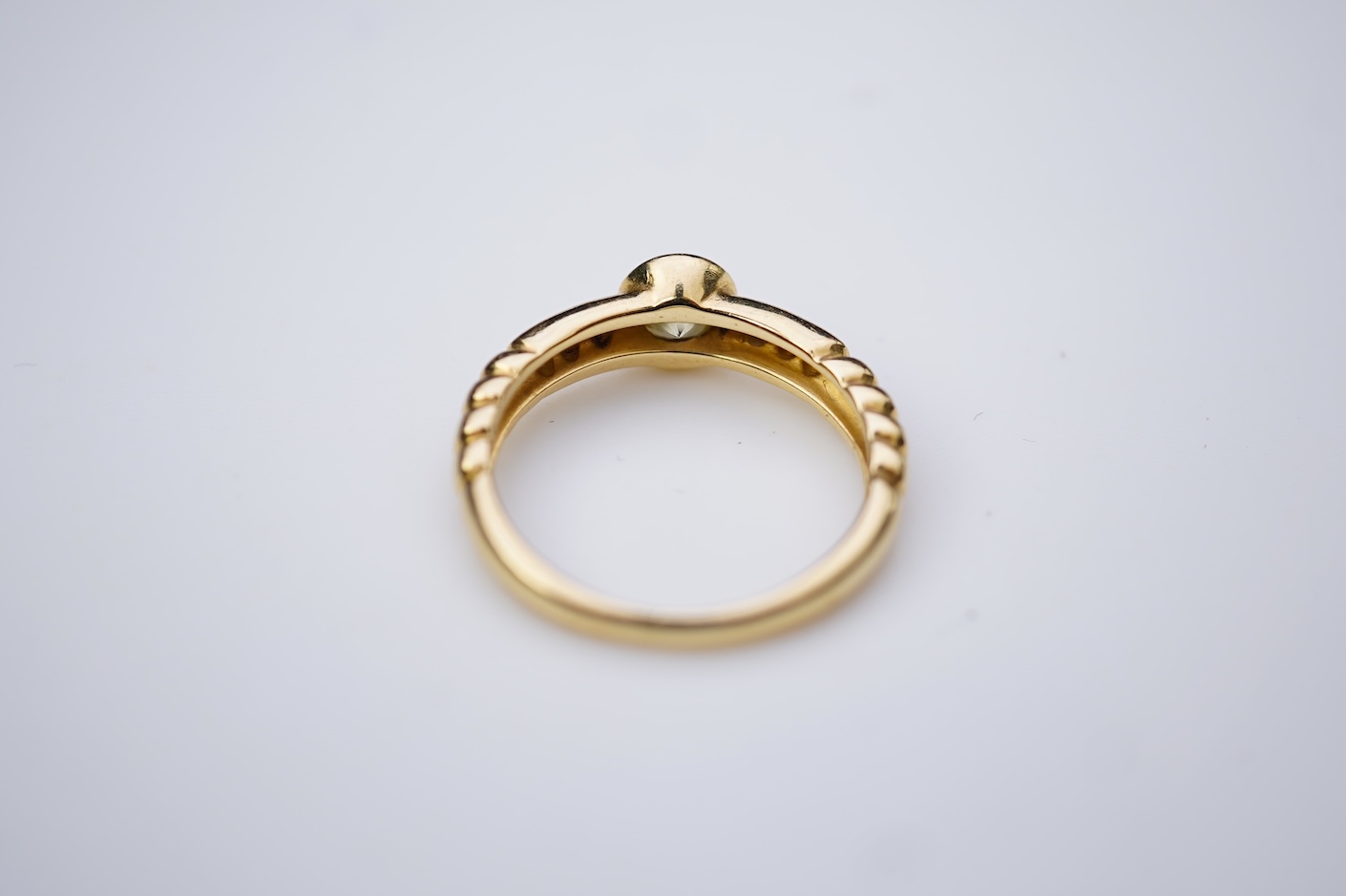 A yellow diamond and diamond ring